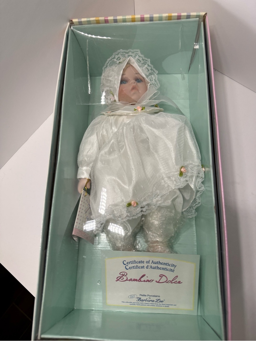 Bambino Dolce Porcelain Baby Doll in White Lace Outfit